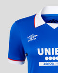 Front-quarter view of Rangers 25/26 Home shirt showing blue jersey with Umbro logo on right chest, crest on left, and UNIBET sponsor.