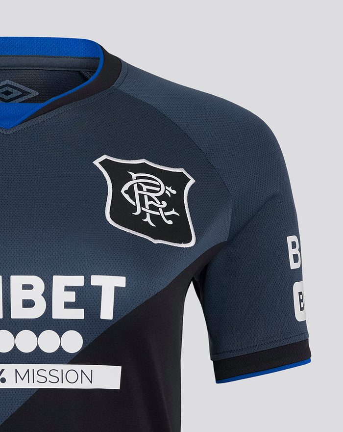 Close-up of navy Rangers jersey shoulder showing the club crest and Umbro logo.