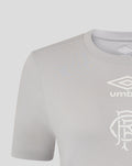 Close up of grey women's T shirt showing ribbed collar and white Umbro logo with club crest on the chest