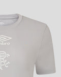 Detail of light grey women's T shirt showing white Umbro wings and club crest print on the chest