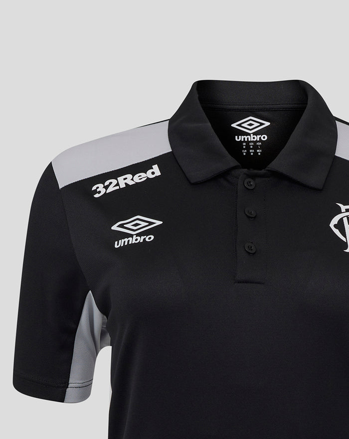 Close up of black poly polo collar with 32Red and Umbro logos on chest and club crest