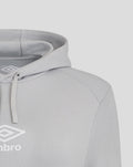 Detail of shoulder seam and hood on a light gray hoodie with visible Umbro logo near chest.