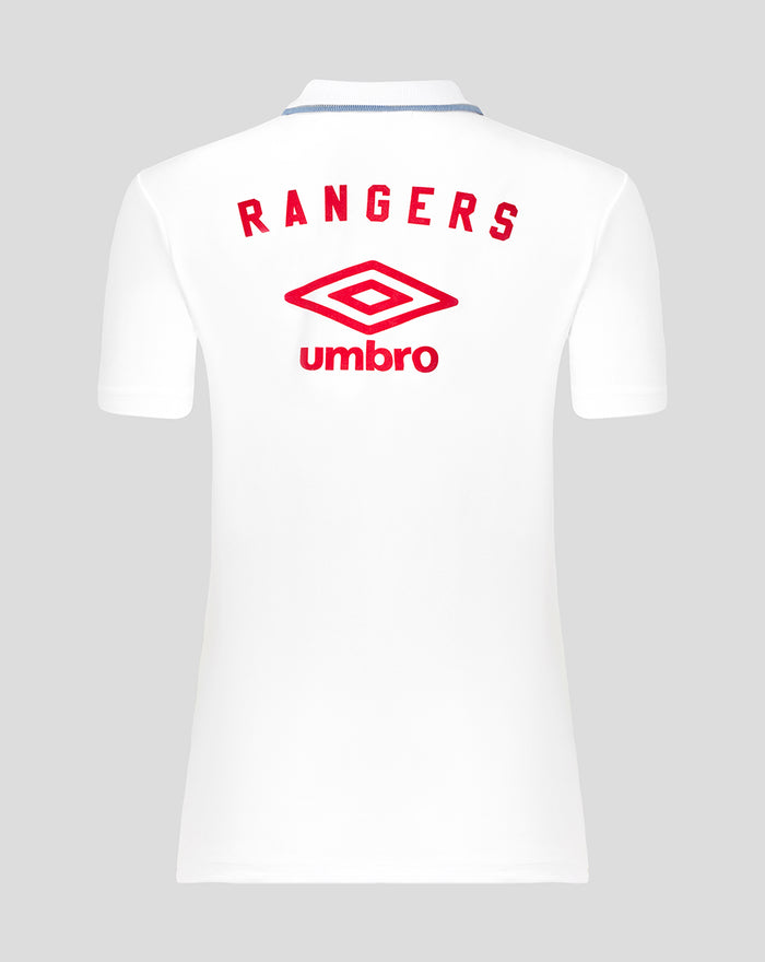 Back view of white travel short sleeve polo with large red Rangers crest and Umbro logo.