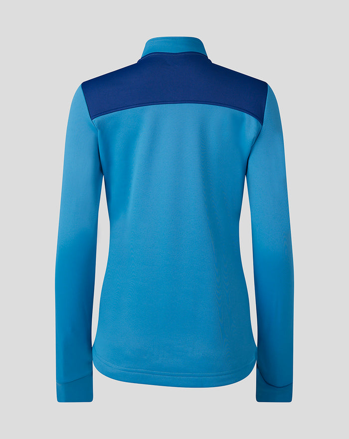 Back view of blue and navy women's training fleece quarter zip midlayer with contrast shoulder panels and funnel collar