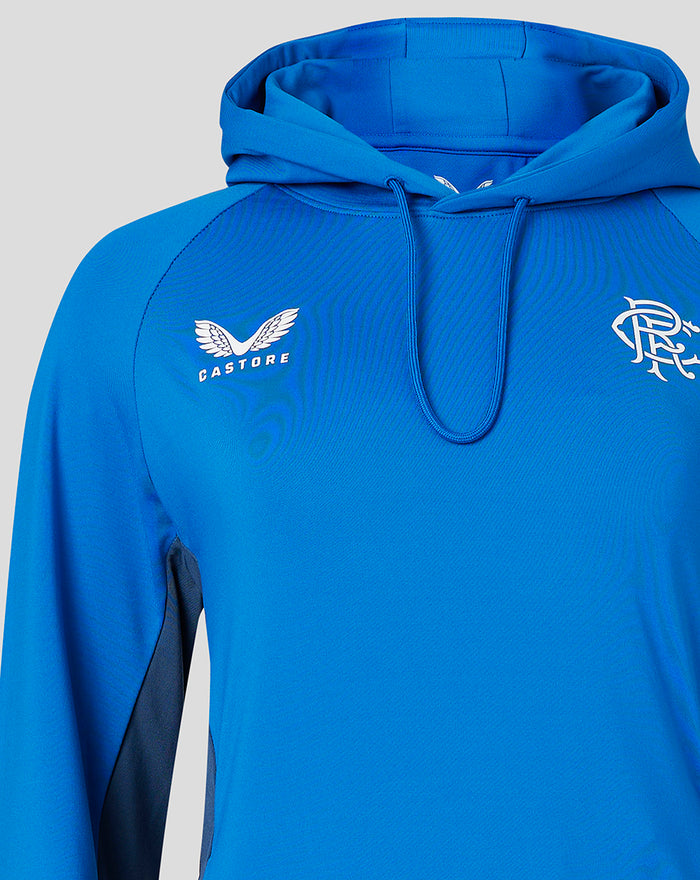 Close-up of blue Women's 23/24 Tech Fleece Hoody showing Castore logo on left chest and crest on right