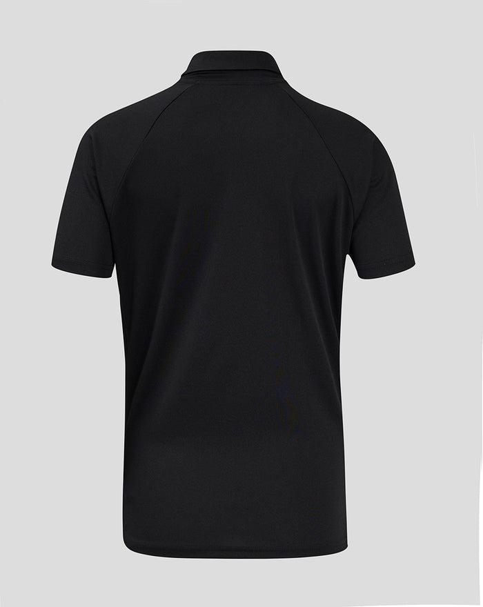 Back view of black polo shirt with short sleeves and clean silhouette.