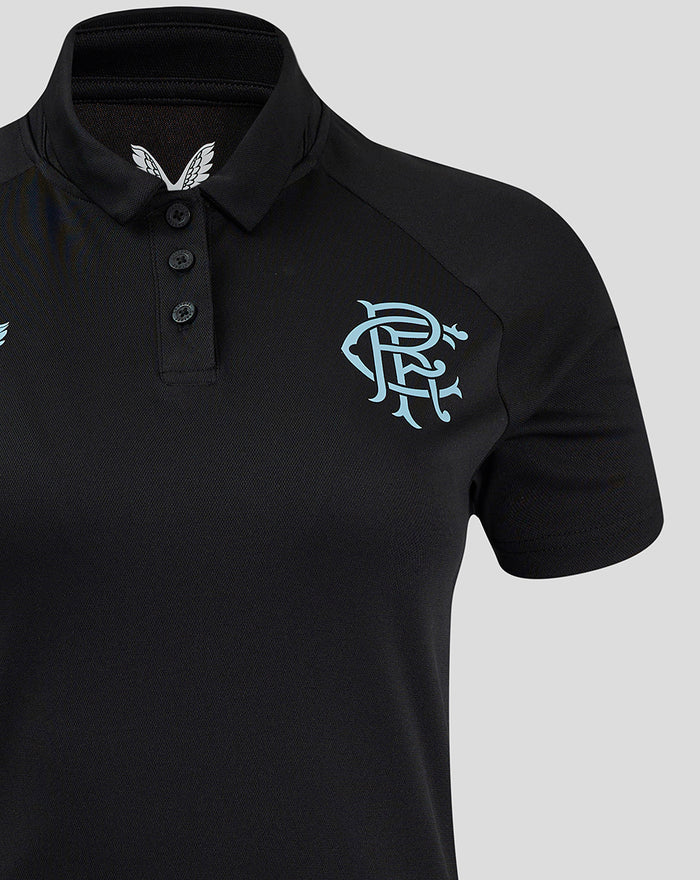 Close-up of black Rangers Pro Coaches Presentation Polo showing a light blue crest on the left chest.