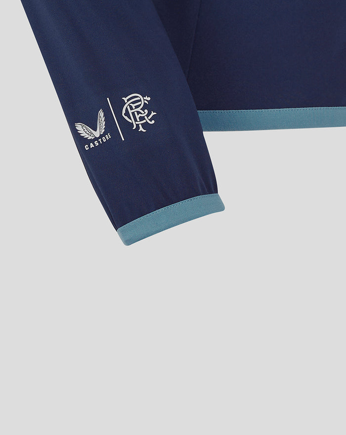 Navy sleeve close up with light blue cuff showing Castore and Rangers FC logos.