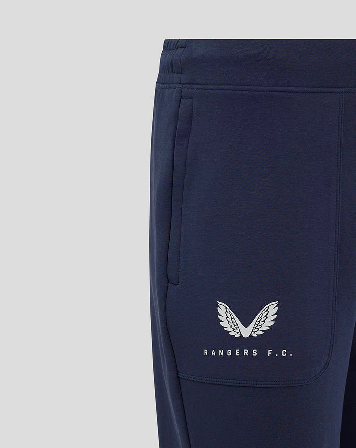 Close-up of navy Women's Rangers FC Travel Pant left pocket area with white crest and branding