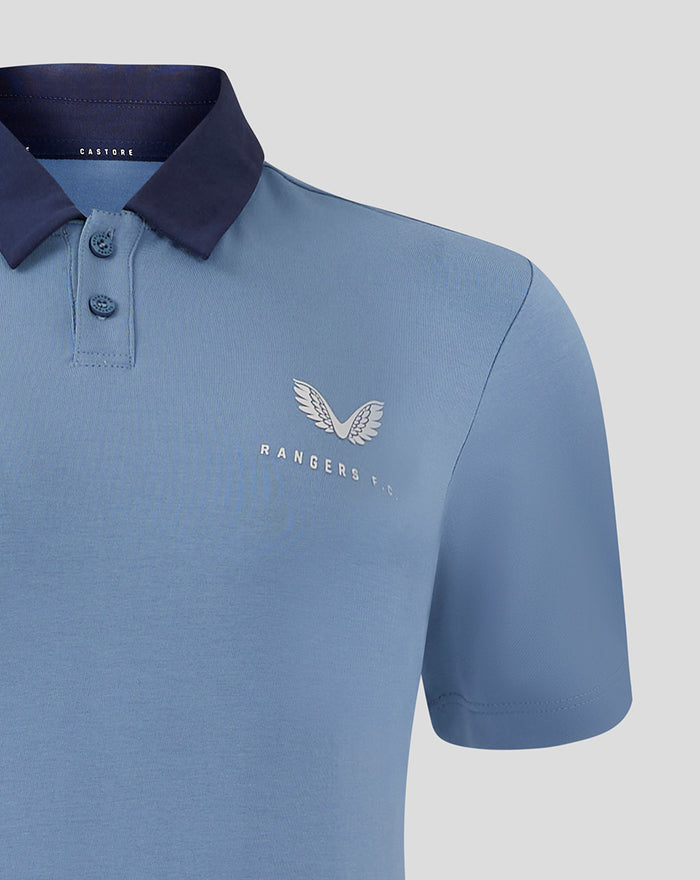 Left chest detail on the light blue travel polo featuring Castore wings and Rangers FC emblem