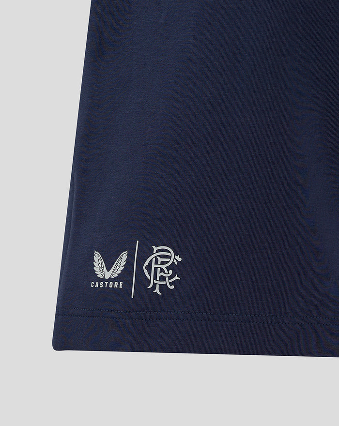 Close up of navy shorts hem displaying Castore and Rangers FC logos on the fabric.
