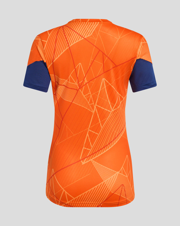 Back view of a bright orange women's league matchday T shirt with blue short sleeves and a geometric line pattern