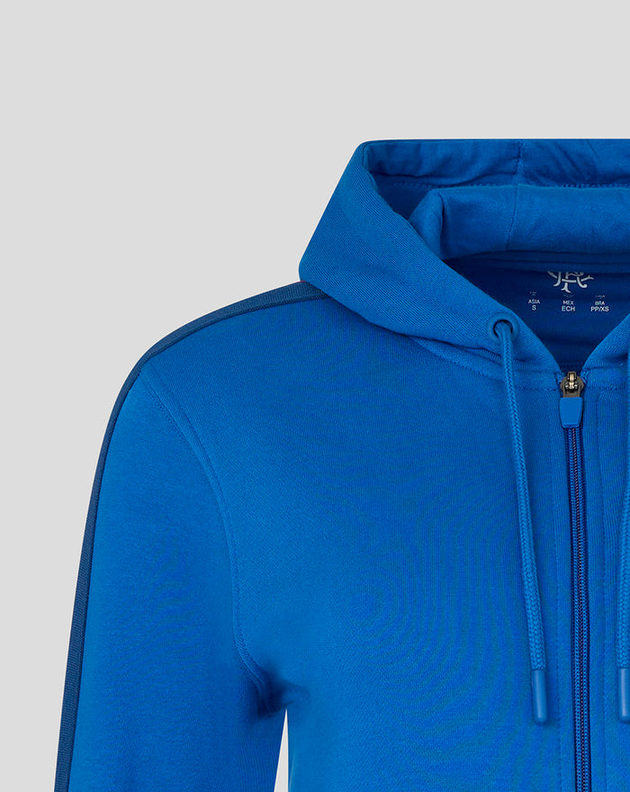 Blue hoodie with hood and zip front drawstrings visible at neckline