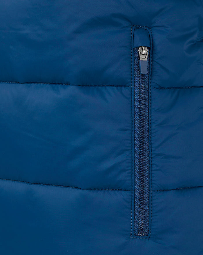 Close-up of navy padded gilet zipper with pull tab.