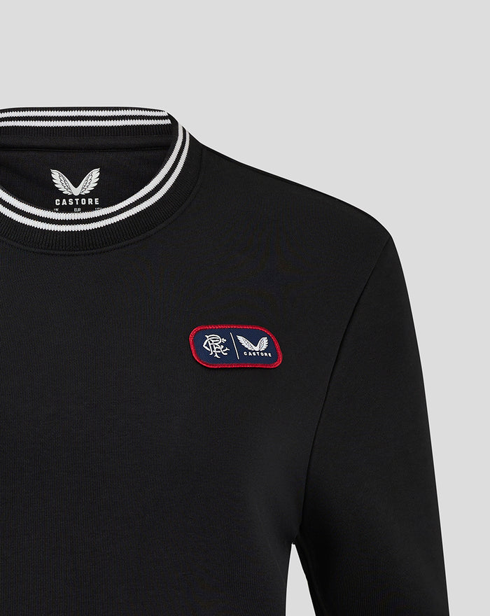 Cropped black fleece crewneck with white striped rib collar and left chest dual branded patch.