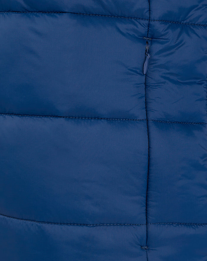 Close-up of navy core puffer jacket front showing exposed full-length zipper and quilted panels.