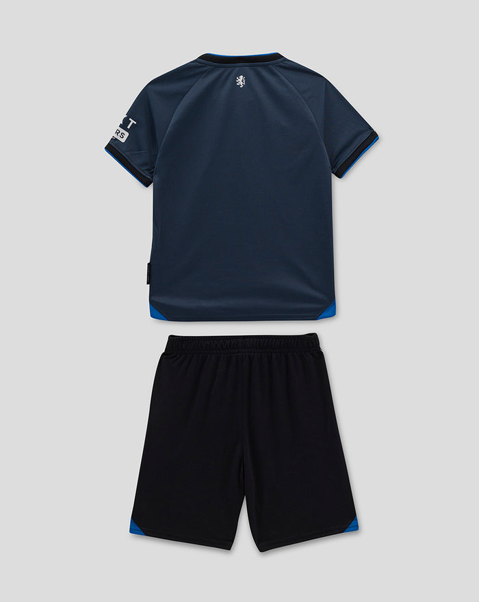 Rangers infant Away 2025–26 shirt with diagonal panel and matching black shorts with blue accents laid flat.