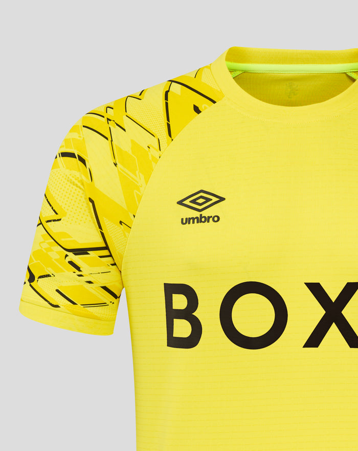 Close up of the yellow junior Rangers 25/26 home goalkeeper shirt showing sleeve pattern and logo