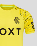 Close up of the yellow junior goalkeeper shirt with neon green collar trim and Rangers crest