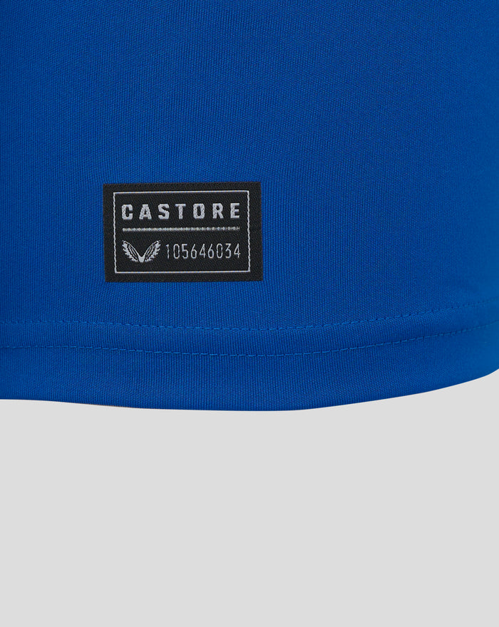 Close-up of blue fabric with a Castore patch on the Ibrox 125 heritage shirt