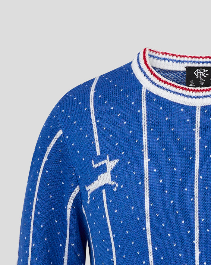 Blue junior retro Christmas jumper close up with white dotted knit and red white striped collar