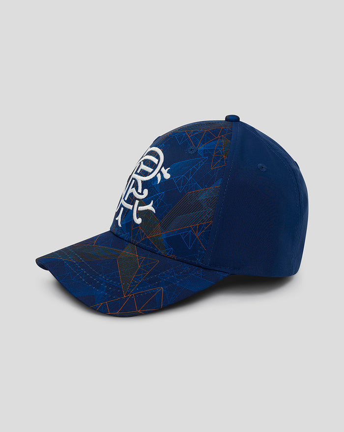 Top and front angle of Club Matchday Cap Juniors in blue with a white emblem and geometric pattern across the crown.