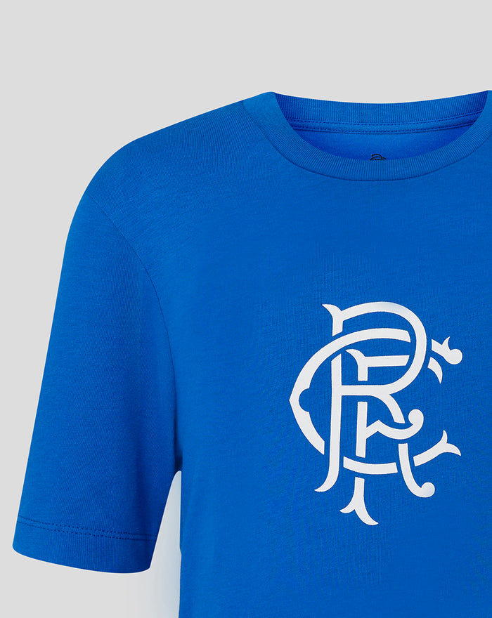 Close-up of the white scroll crest on the lapis blue Rangers junior core logo tee.