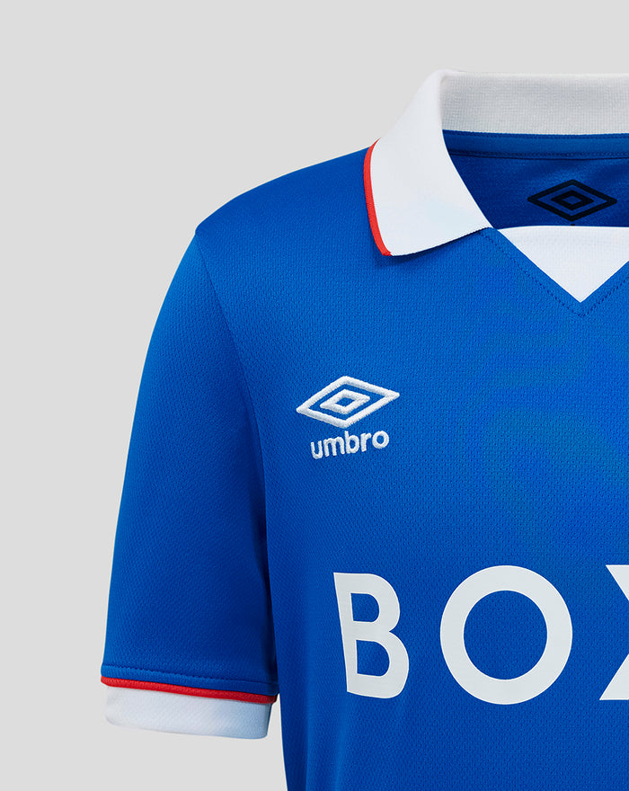 Sleeve detail of blue Rangers junior shirt with BOXT BOILERS sponsor graphic and white cuff trim.