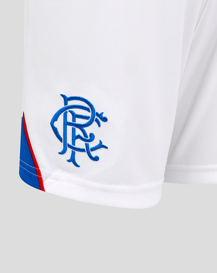 Close up of white Rangers home shorts with a blue club crest on the left thigh and blue curved hem with red accent
