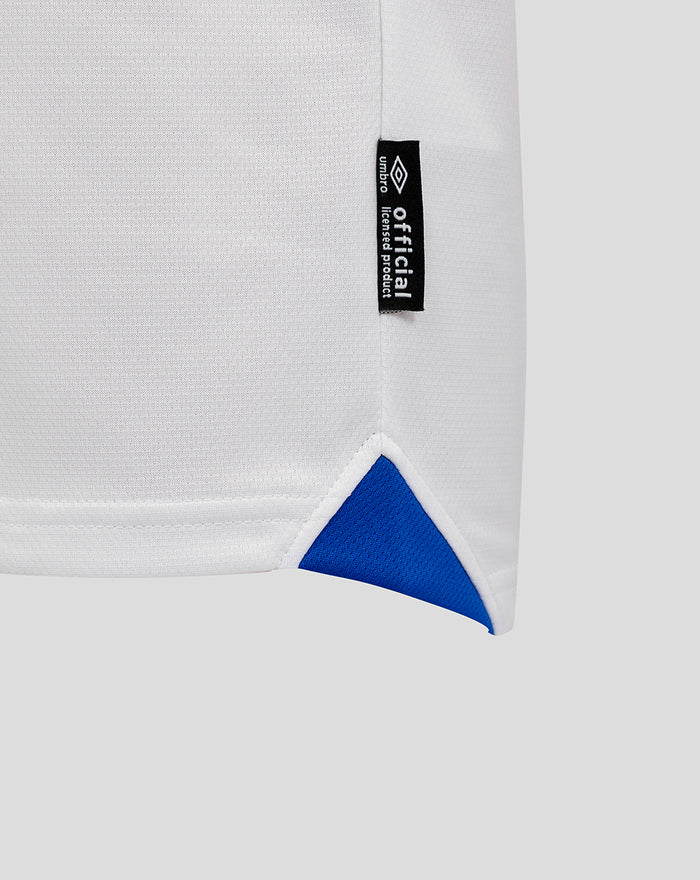 White Rangers junior away shirt fabric with a black official licensed product tag along the side seam and a blue hem triangle.