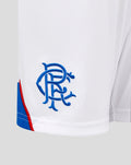Close-up of white Rangers FC away shorts showing blue embroidered club crest and blue hem trim.