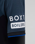 Close-up of navy sleeve on junior Rangers third shirt showing ribbed cuff and BOXI BOILERS sponsor patch.