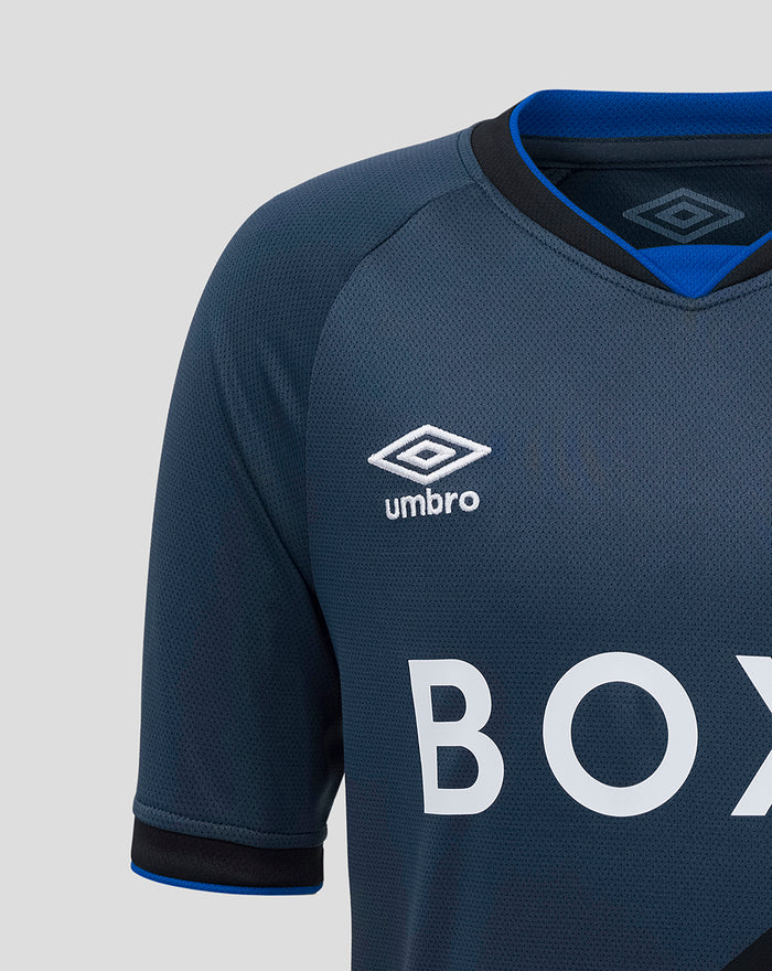 Close-up of upper chest showing Umbro logo and diagonal color block on Rangers junior third shirt.