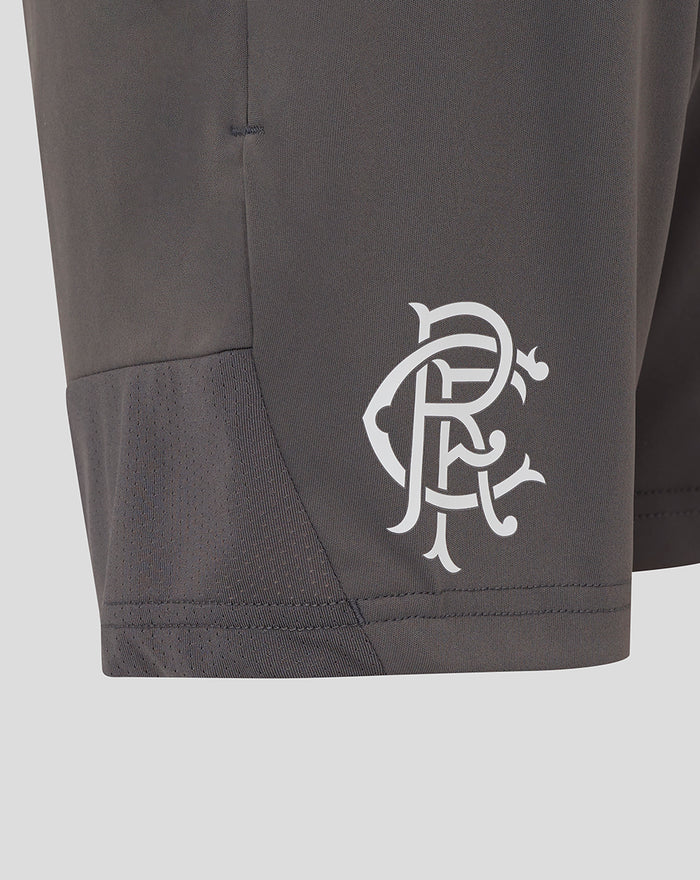 Close up of the left leg lower panel showing the crest and stitched hem detail on junior Thunderstorm shorts