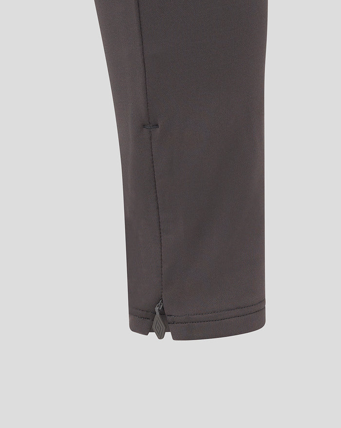 Lower leg view of junior pro training knit pant in thunderstorm color with ankle zip