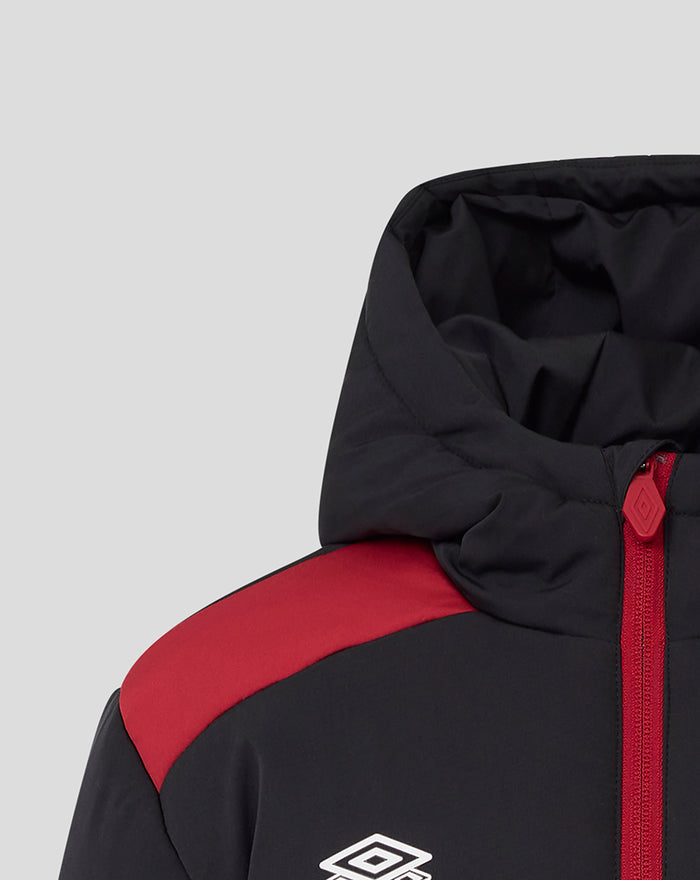 Close-up of the hooded jacket showing the red front zipper and red shoulder panel detail with the Umbro logo.