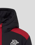 Close-up of hooded junior padded jacket with black fabric red shoulder panel and white crest on the chest.