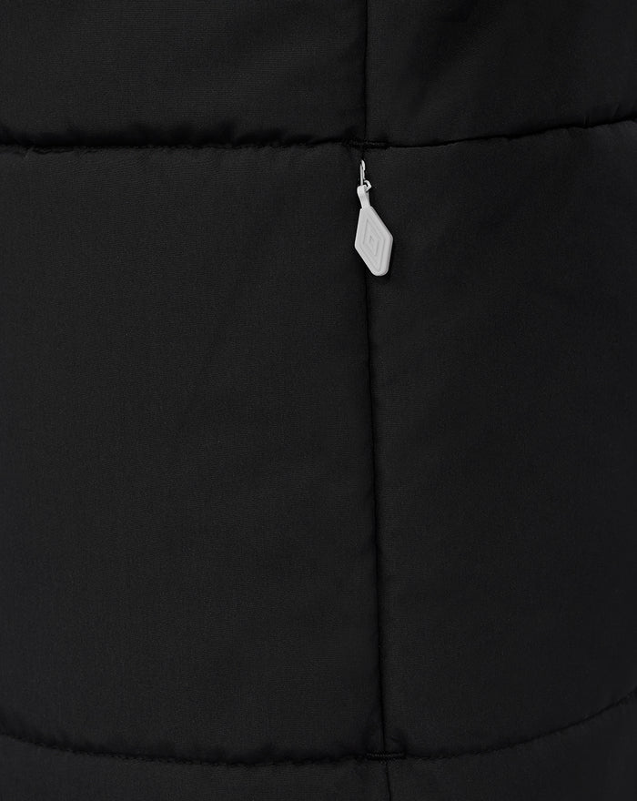 Shoulder and chest detail of black padded jacket with light grey panel and Castore branding