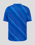 Back view of blue junior home matchday tee with white and red diagonal stripes