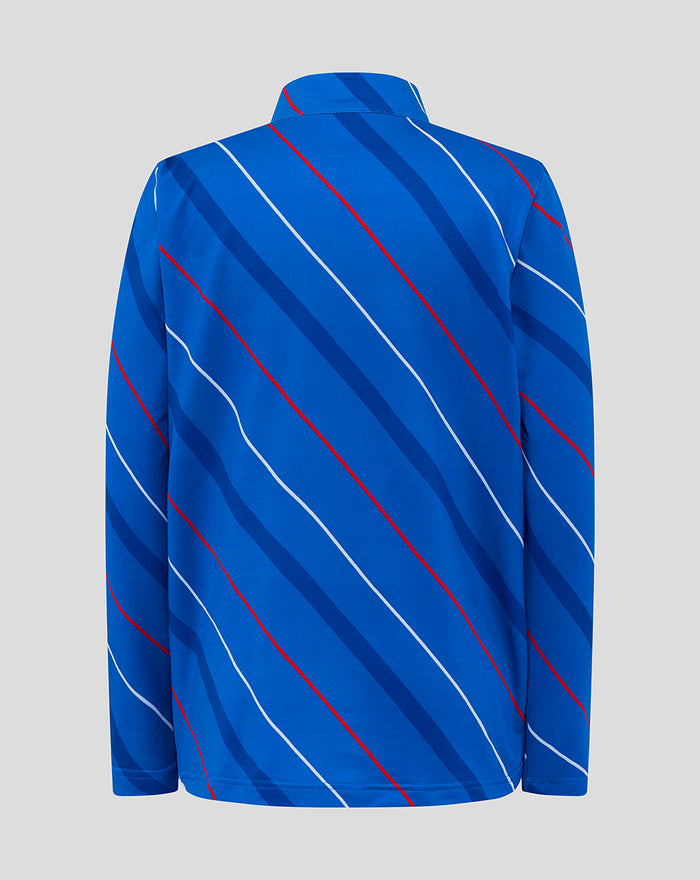 Back view of blue junior home matchday jacket with diagonal red and white stripes across the fabric.