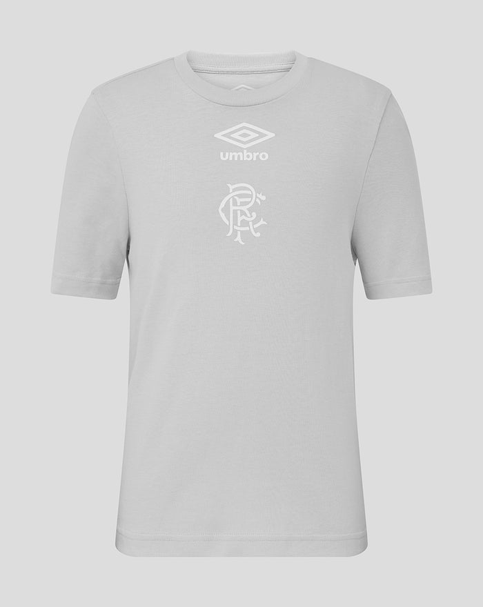 Front view of junior light gray T shirt with Umbro logo above a club crest on the chest.