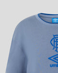 Close up of the grey jersey neckline and shoulder with blue Umbro tag at the collar and partial crest.