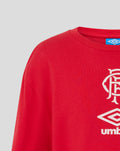 Red junior travel T shirt with white Umbro crest and club emblem on the chest