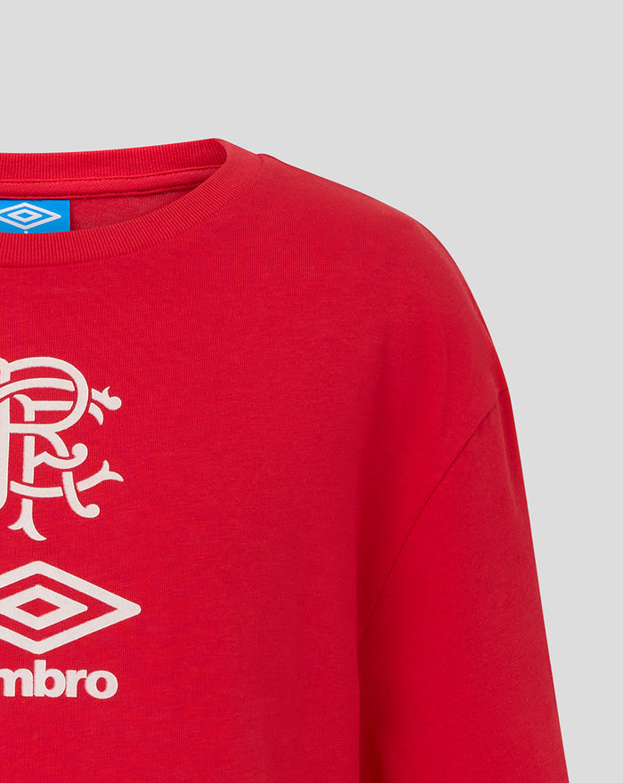 Red Junior travel T shirt front close up showing white Umbro crest and club emblem