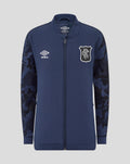 Front view of navy Junior 25/26 Third Matchday Jacket with full zip; Umbro logo on left chest and club crest on right, sleeves with blue camouflage pattern.