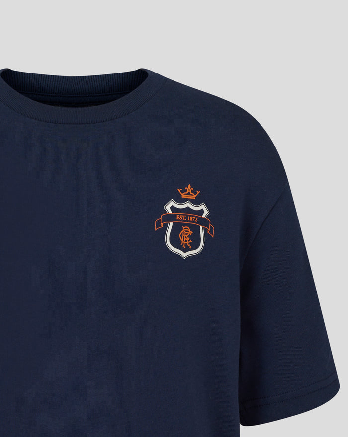 Close-up of navy Rangers junior t shirt chest displaying the orange scroll crest.
