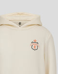Back view of the cream Junior Rangers Hoodie displaying the Rangers crest with an orange EST 1872 banner
