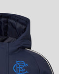 Close-up of navy Junior 25/26 Travel Bench Jacket hood with a blue crest logo on the chest