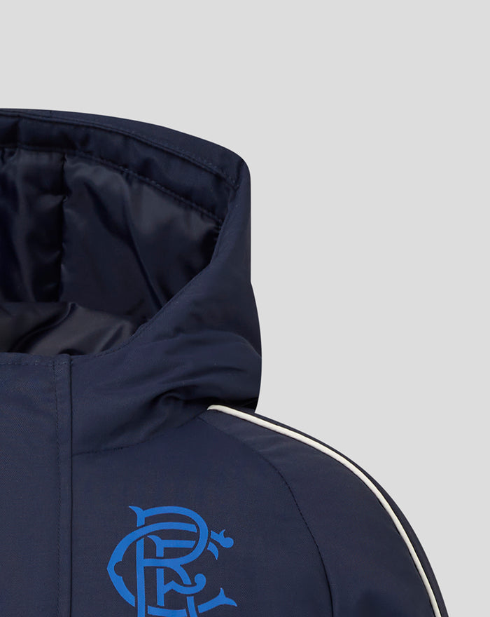Close-up of navy Junior 25/26 Travel Bench Jacket hood with a blue crest logo on the chest