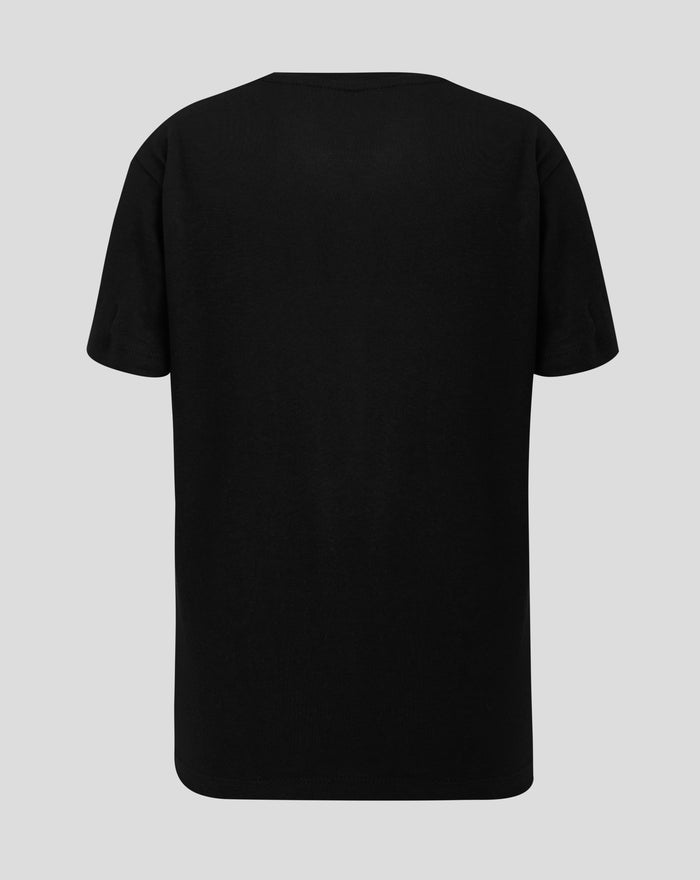 Back view of a plain black junior varsity tonal typography tee on a light gray background